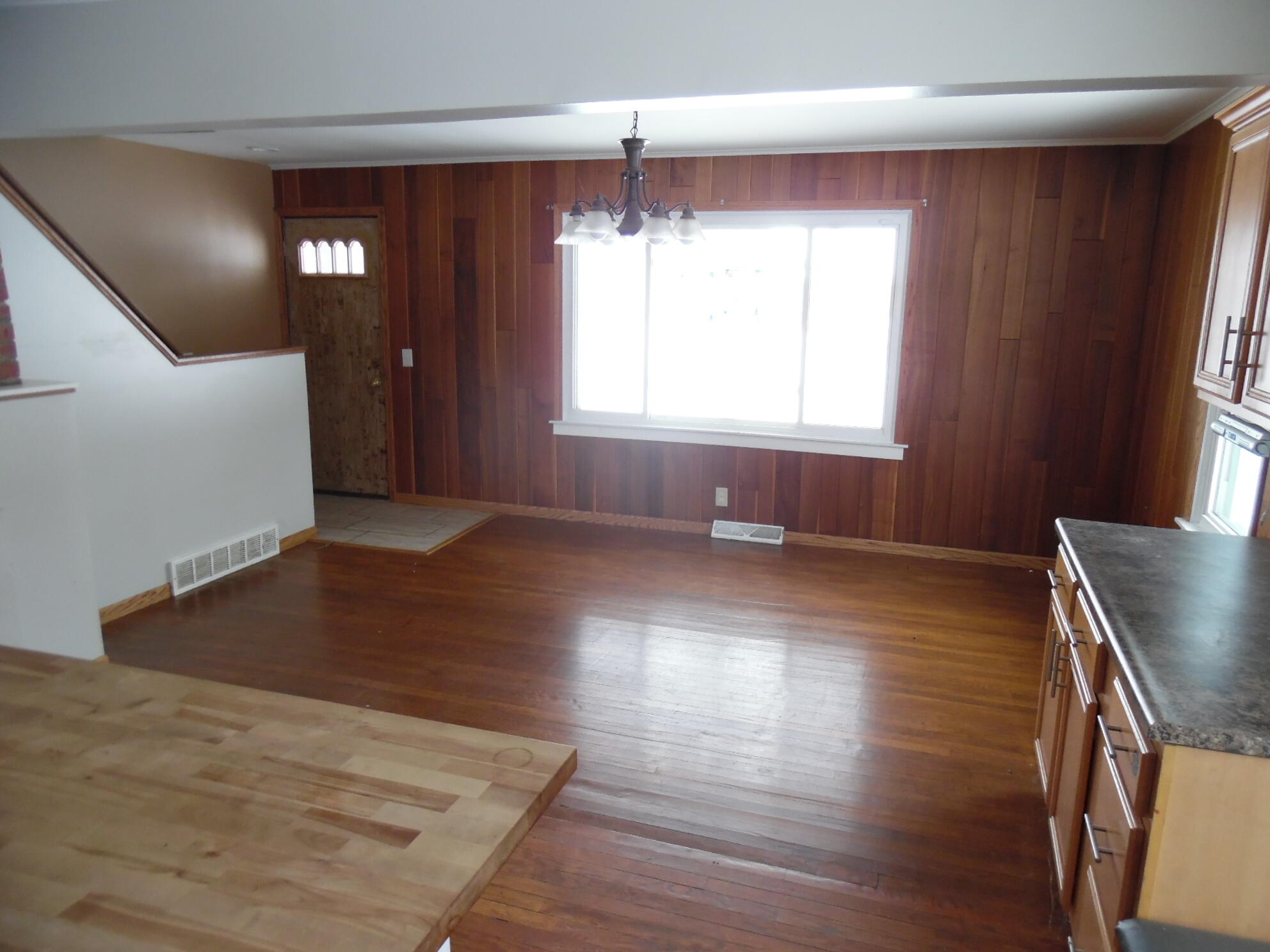 813 West Division Road De Motte, IN 46310 - Photo 5 of 20 an empty room with wooden floor and windows