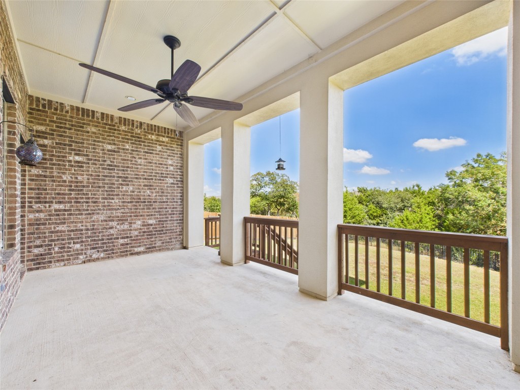 2624 Outlook Ridge Loop Leander, TX 78641 - Photo 37 of 39 a view of a porch with wooden floor and a floor to ceiling window