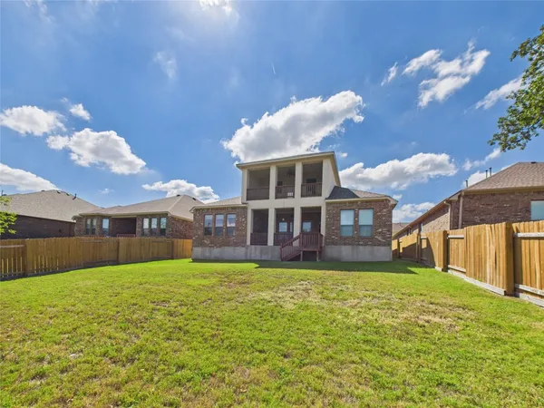a view of a house with a big yard