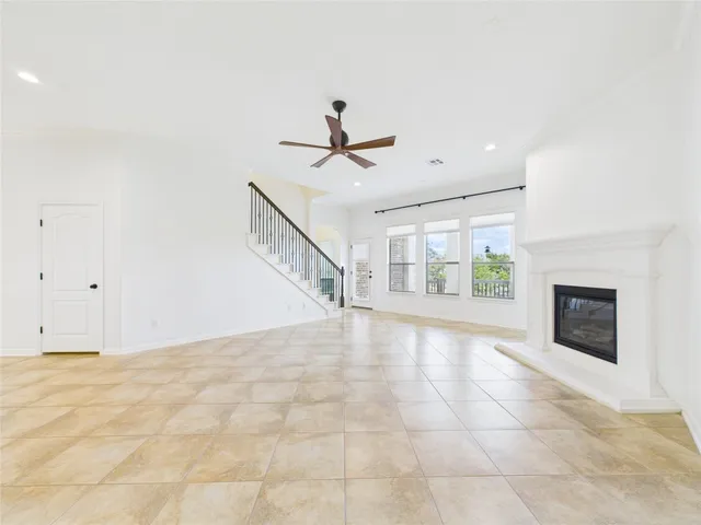 a view of an empty room with a fireplace