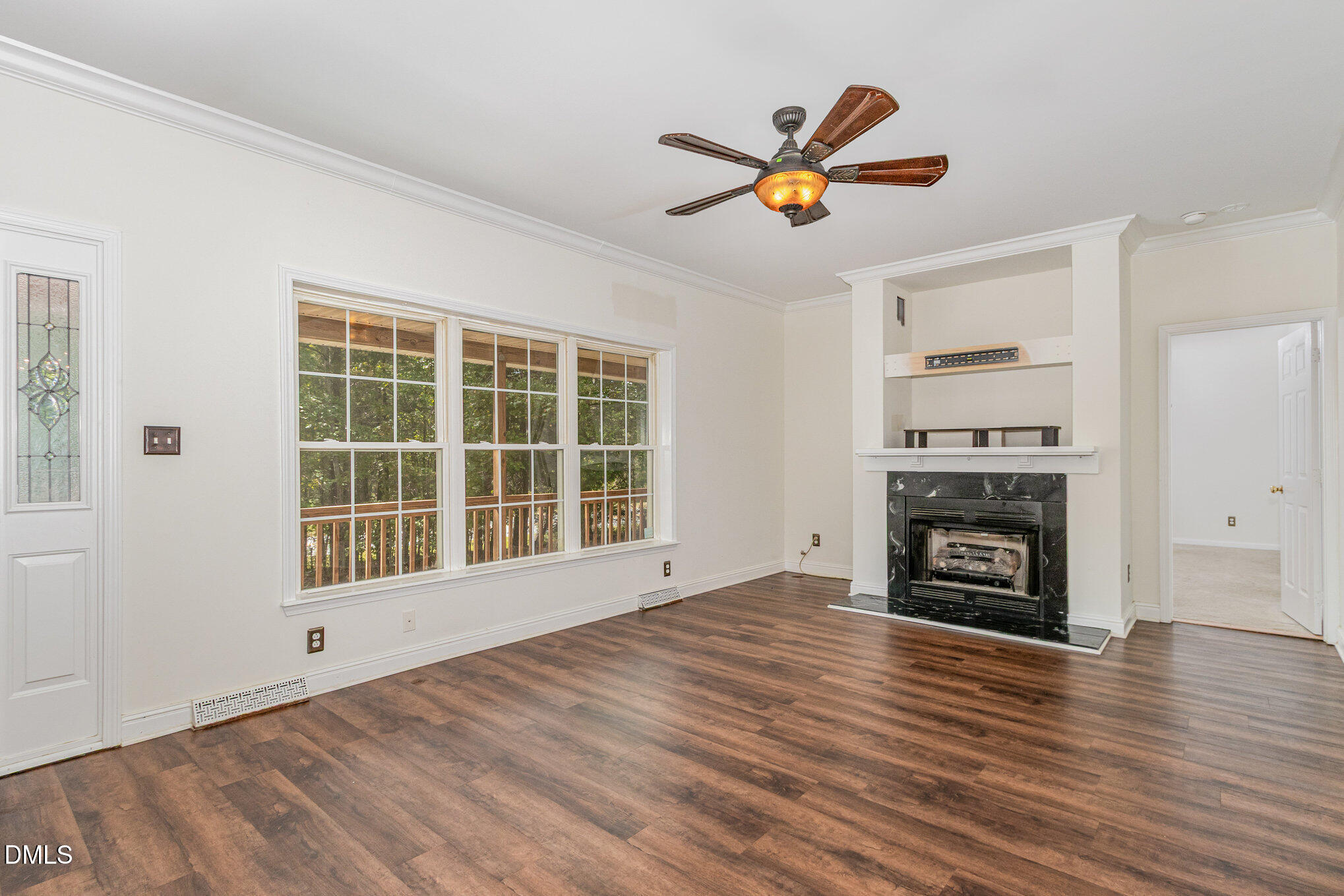 1176 Stoney Mountain Road Rougemont, NC 27572 - Photo 10 of 44 a view of an empty room with a fireplace and a window