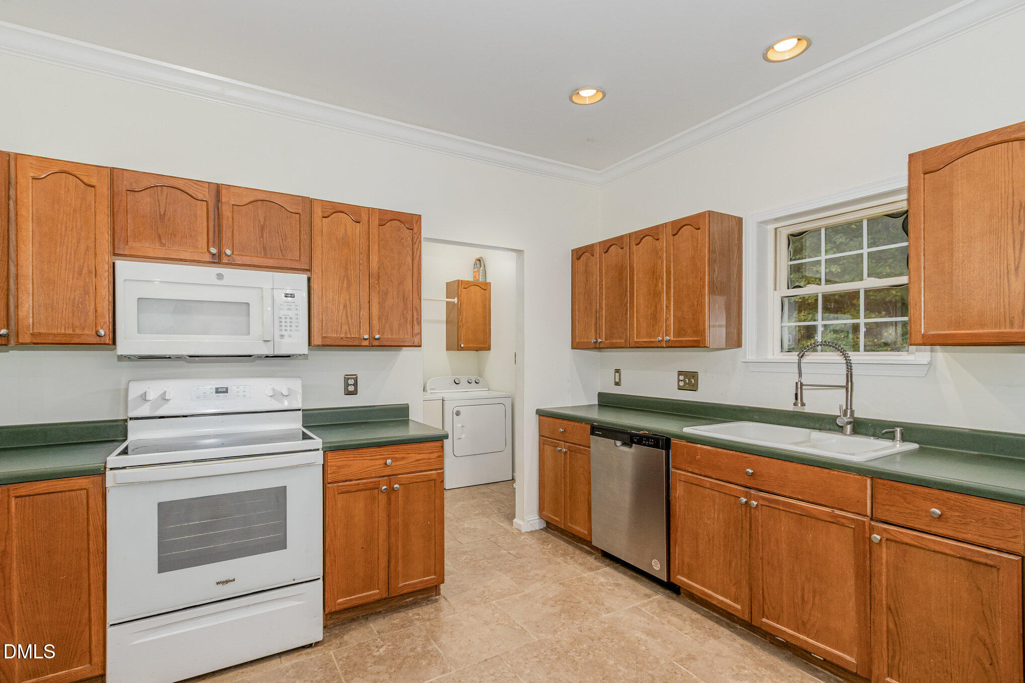 1176 Stoney Mountain Road Rougemont, NC 27572 - Photo 18 of 44 a kitchen with stainless steel appliances granite countertop a sink stove and cabinets