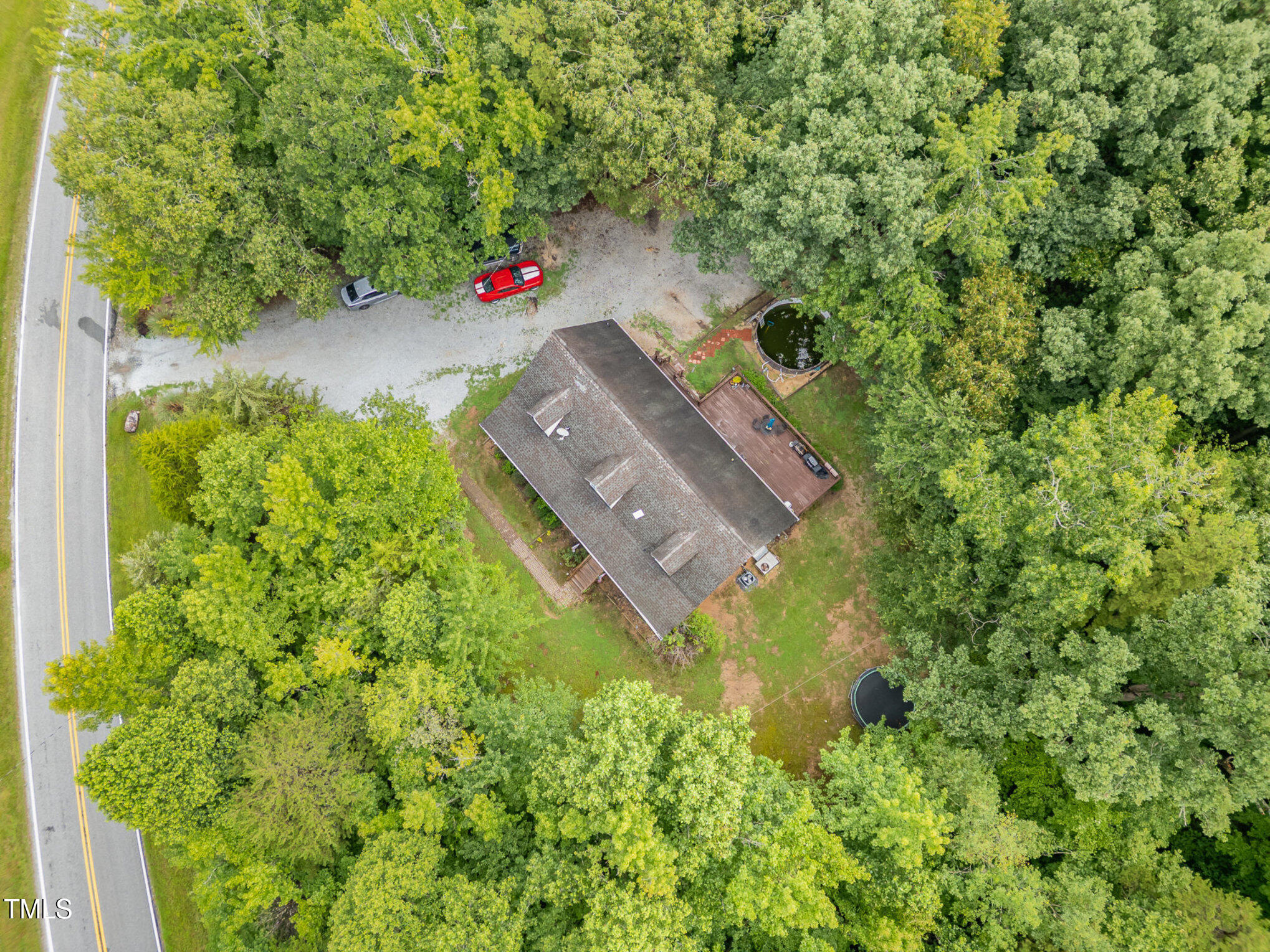 1176 Stoney Mountain Road Rougemont, NC 27572 - Photo 2 of 44 an aerial view of a house with a yard basket ball court and outdoor seating