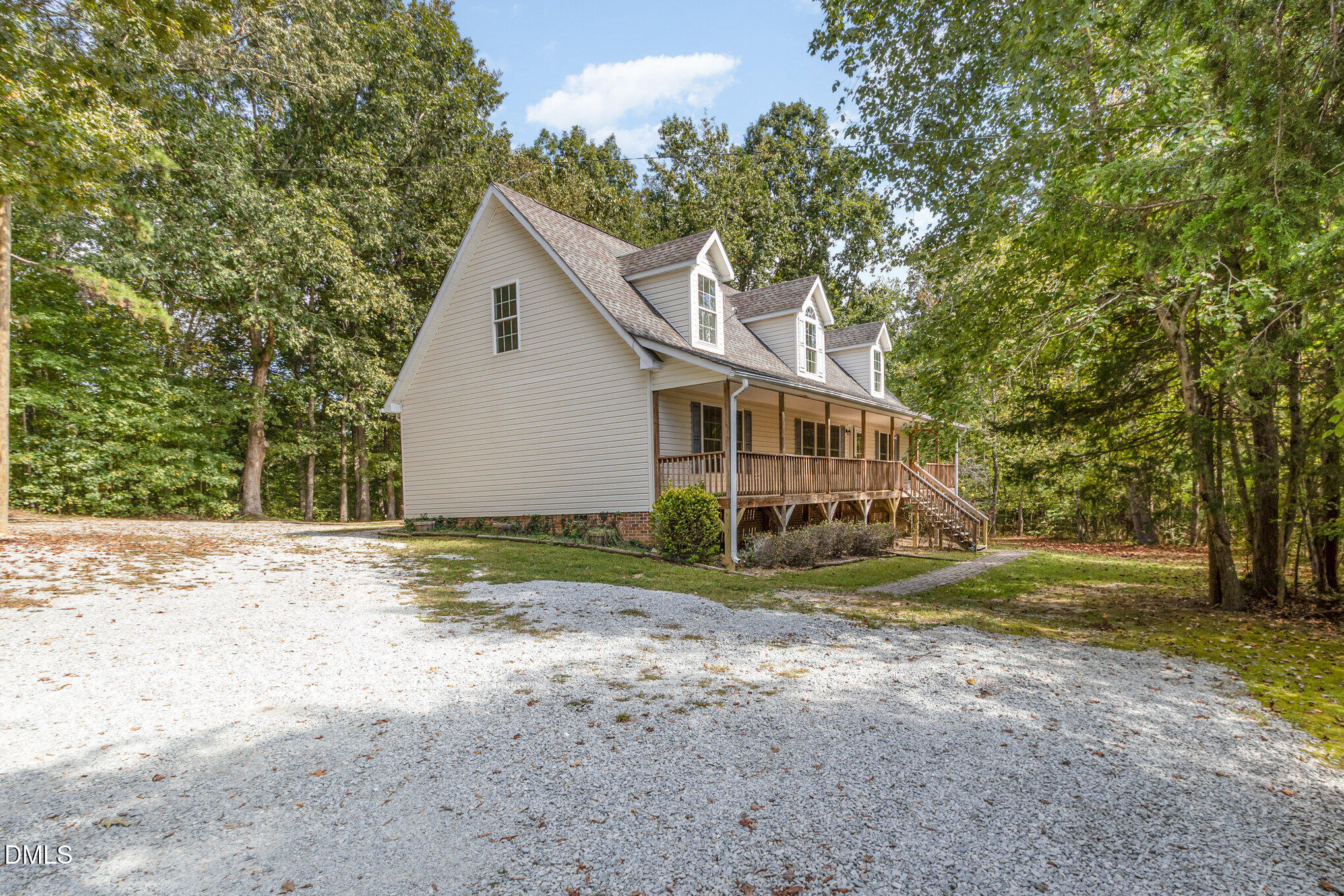 1176 Stoney Mountain Road Rougemont, NC 27572 - Photo 35 of 44 a view of a house with a yard and large trees