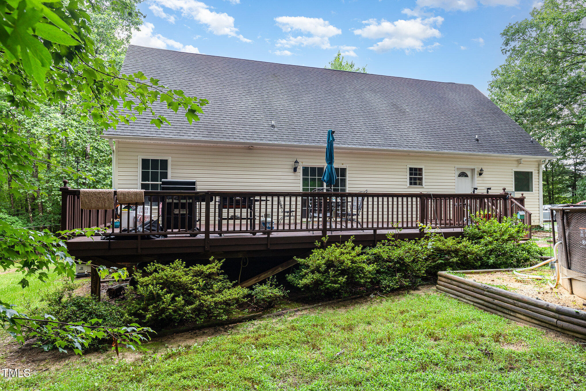 1176 Stoney Mountain Road Rougemont, NC 27572 - Photo 37 of 44 a view of a house with wooden deck and a yard