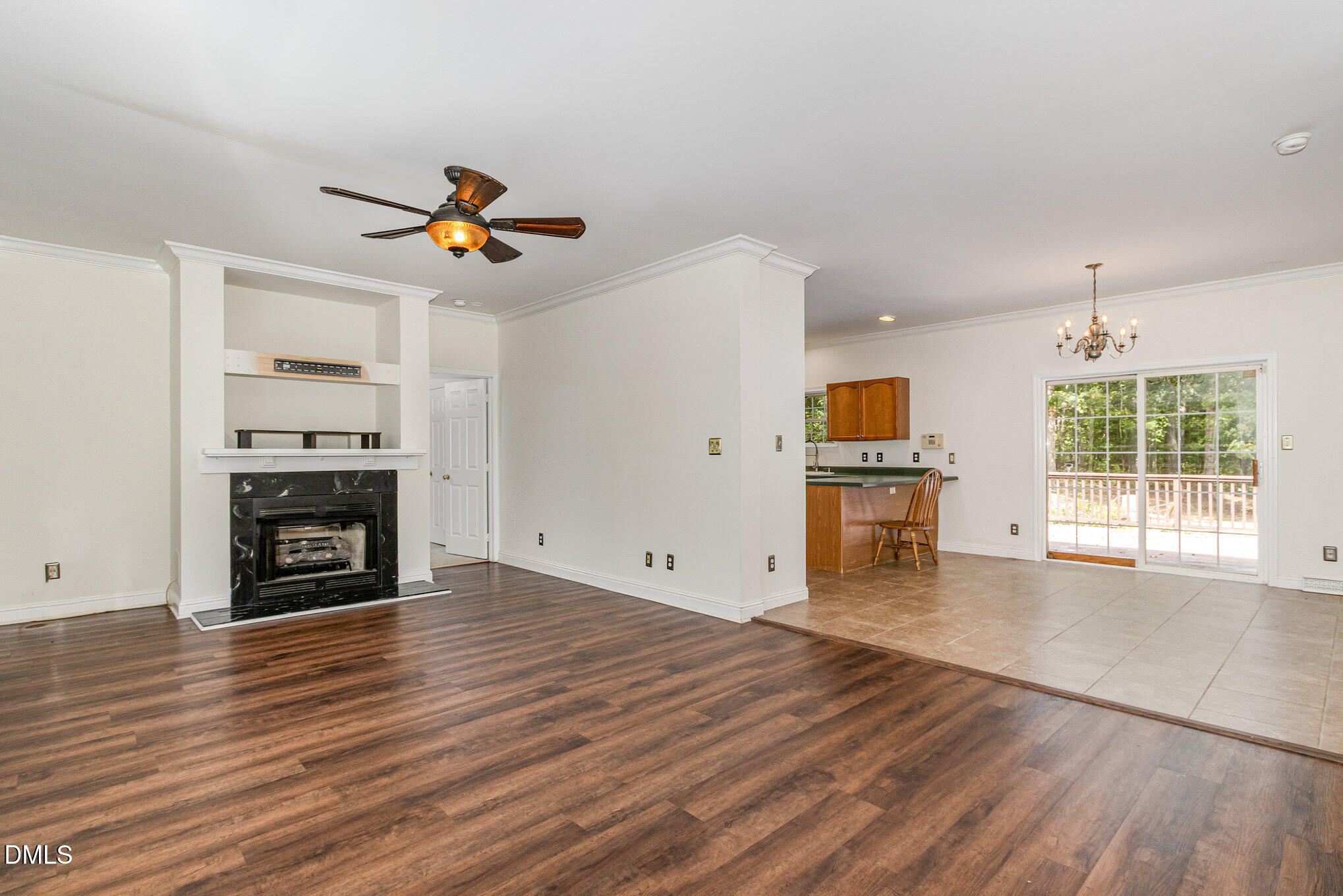 1176 Stoney Mountain Road Rougemont, NC 27572 - Photo 9 of 44 an empty room with windows fireplace and cabinet