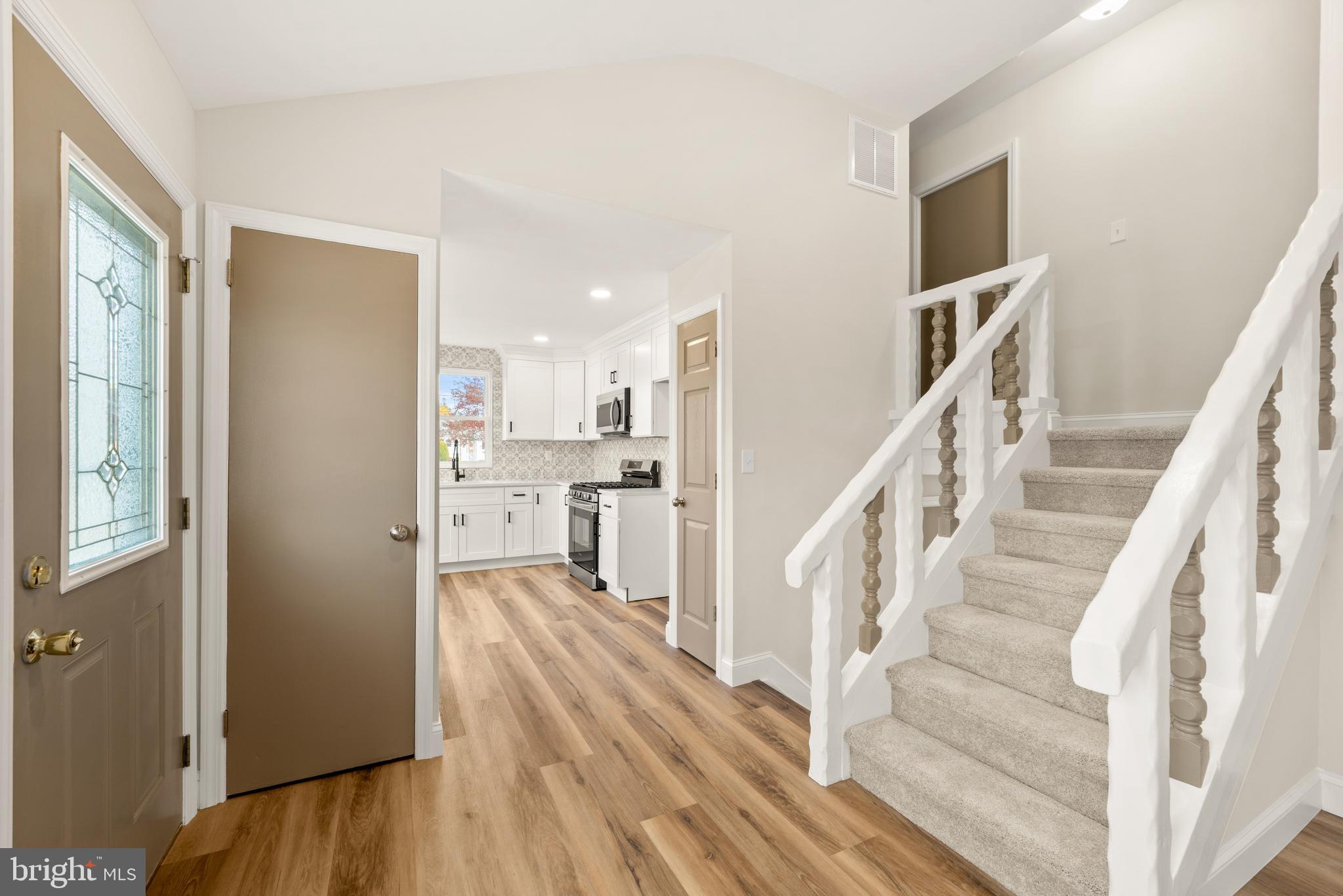 23 Hastings Road Hamilton, NJ 08620 - Photo 8 of 35 a view of a hallway with wooden floor and entryway