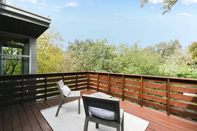 a view of a chairs and table on the wooden floor