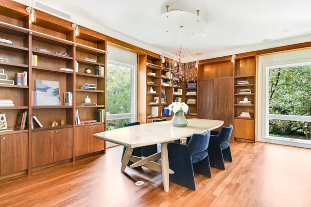 a view of a dining room with furniture window and wooden floor