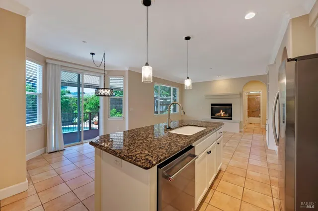 a kitchen with granite countertop a sink and a counter