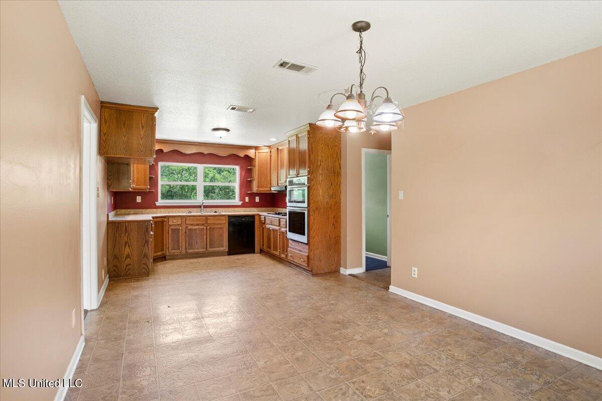 26290 Wolf Creek Road Kiln, MS 39556 - Photo 18 of 40 16-Dining to Kitchen