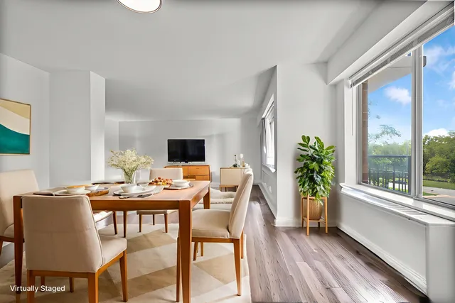 a dining room with furniture and window