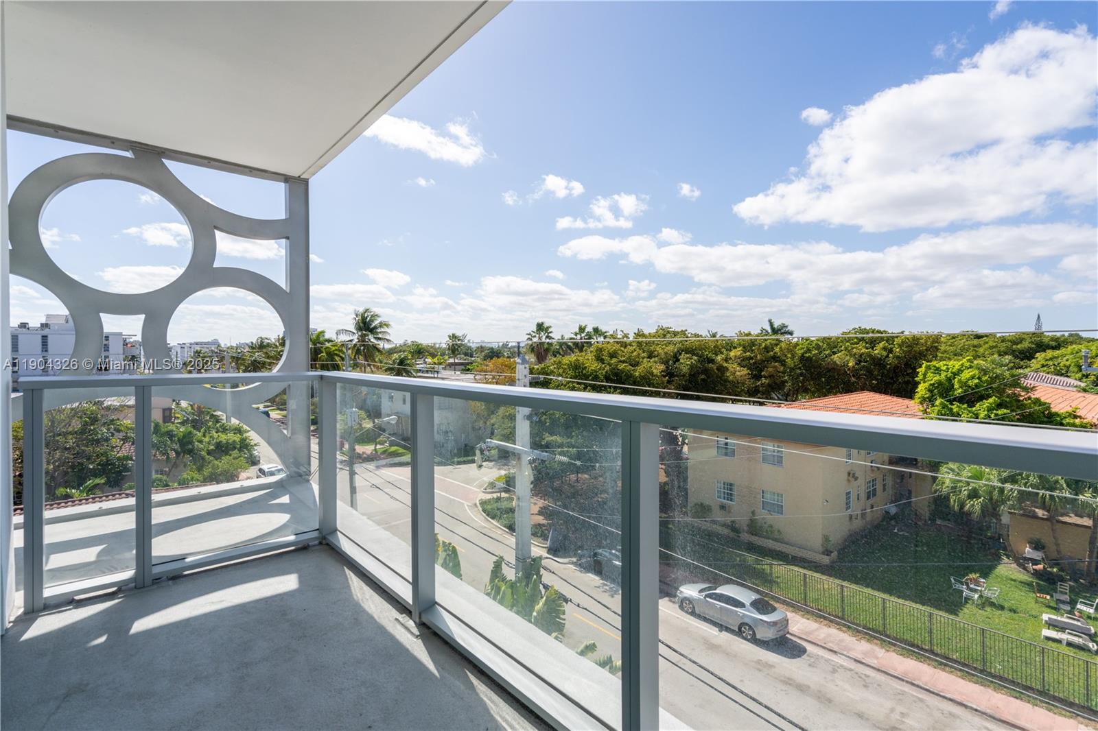 8425 Crespi Boulevard, Unit 404 Miami Beach, FL 33141 - Photo 4 of 21 a view of a street from a balcony