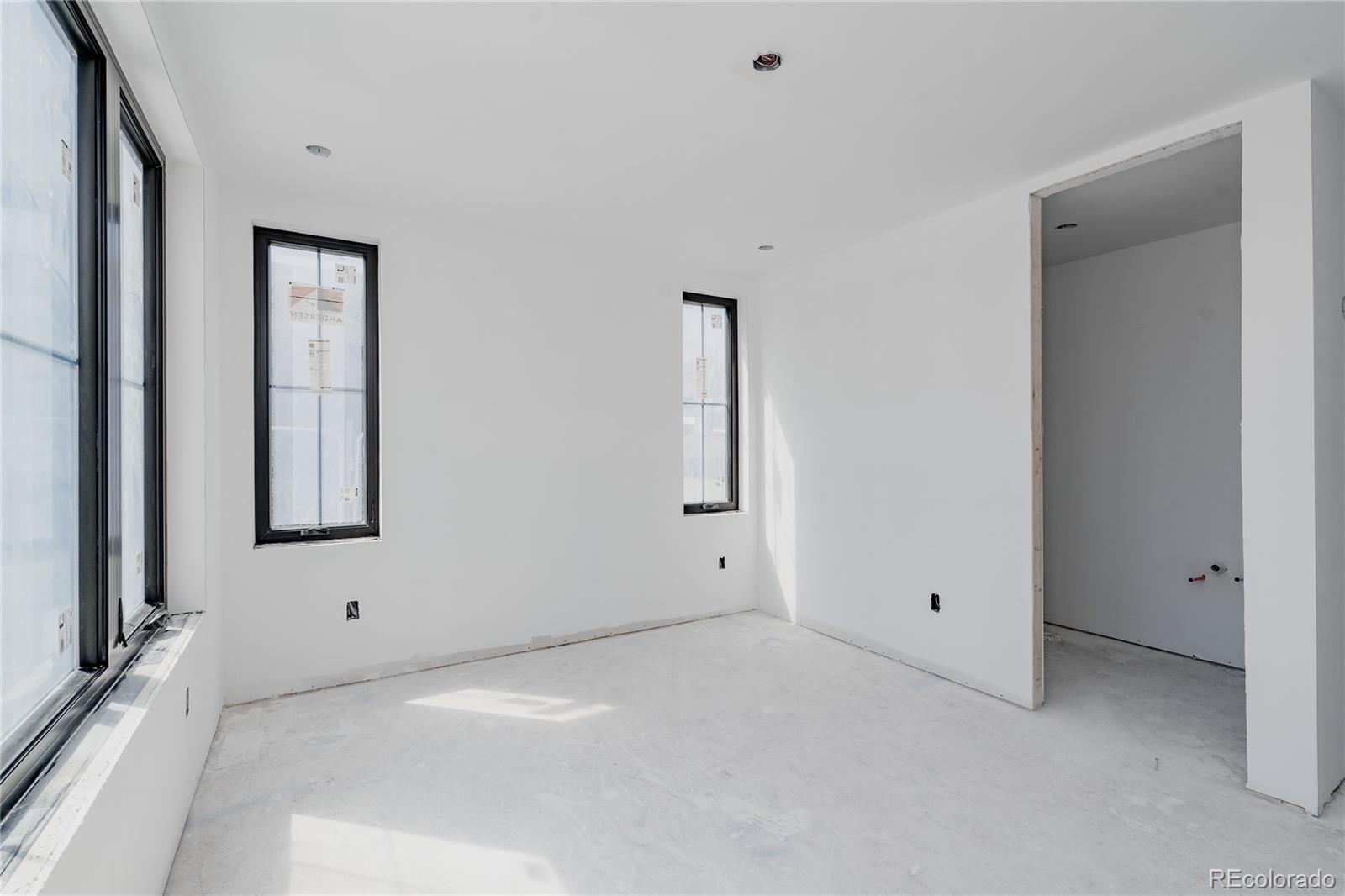 1935 Meade Street Denver, CO 80204 - Photo 16 of 43 a view of an empty room with a window