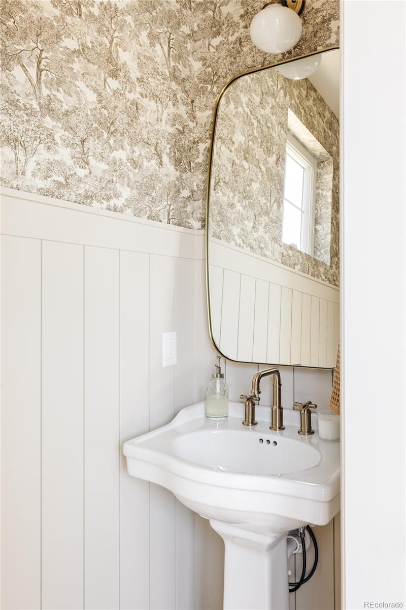 1935 Meade Street Denver, CO 80204 - Photo 36 of 43 a bathroom with a sink and a mirror