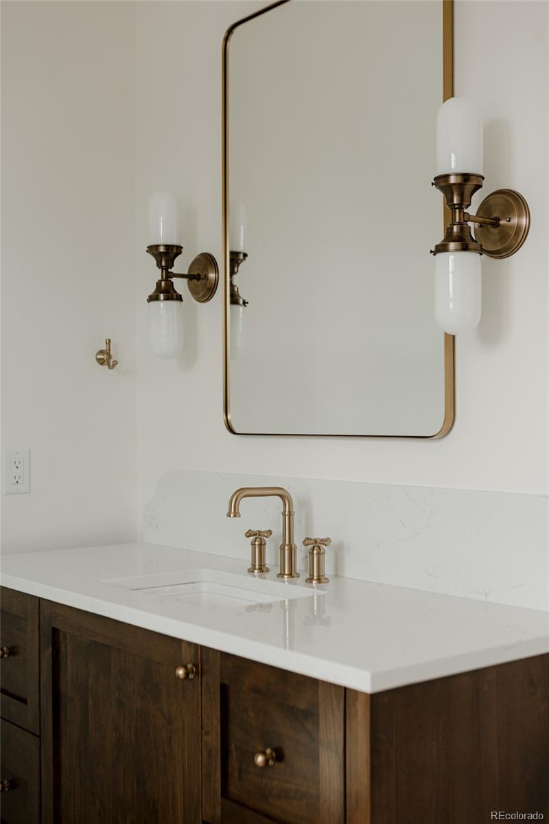 1935 Meade Street Denver, CO 80204 - Photo 37 of 43 a bathroom with a sink and mirror