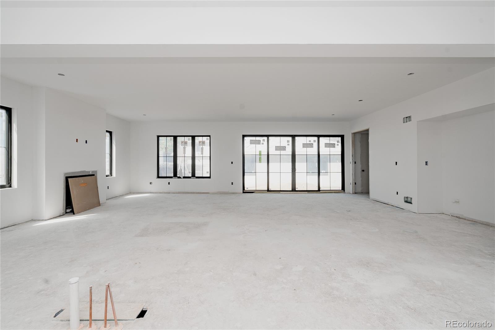 1935 Meade Street Denver, CO 80204 - Photo 4 of 43 a view of an empty room with a window