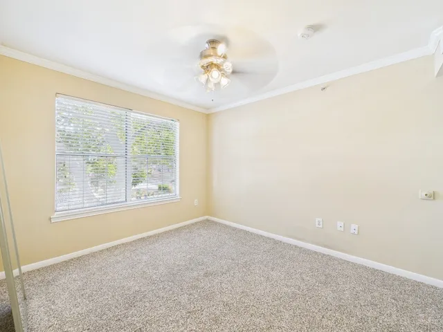 a bathroom with a sink mirror vanity and toilet