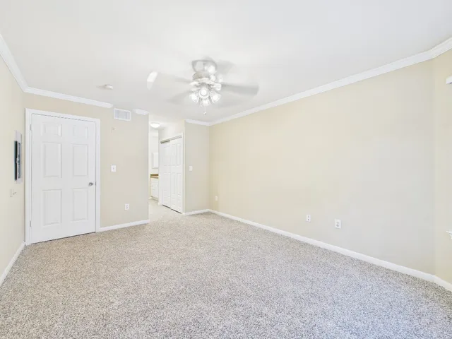 a bathroom with a granite countertop sink a mirror and a shower