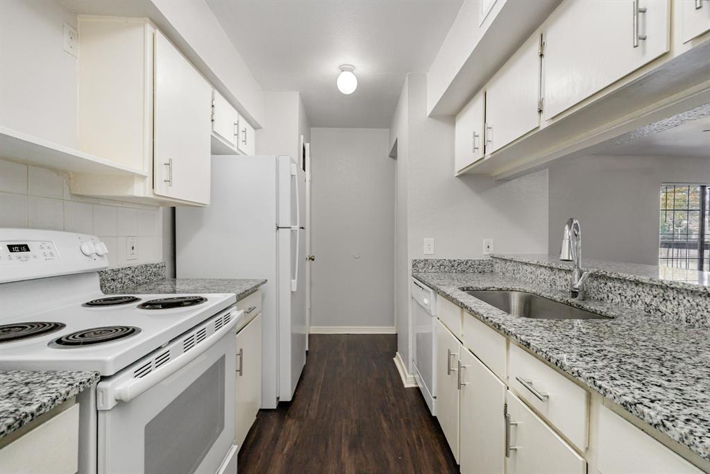 12480 Abrams Road, Unit 723 Dallas, TX 75243 - Photo 11 of 19 a kitchen with a sink stove and cabinets