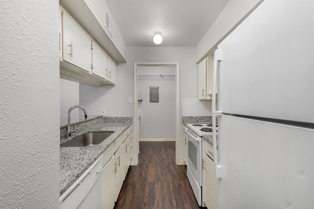 12480 Abrams Road, Unit 723 Dallas, TX 75243 - Photo 12 of 19 a kitchen with stainless steel appliances granite countertop a sink stove and refrigerator