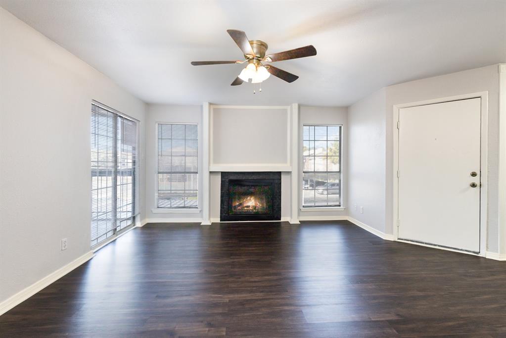 12480 Abrams Road, Unit 723 Dallas, TX 75243 - Photo 3 of 19 a view of an empty room with wooden floor and a window