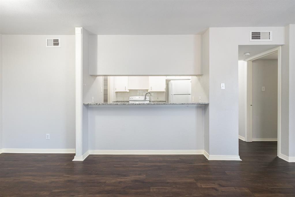 12480 Abrams Road, Unit 723 Dallas, TX 75243 - Photo 8 of 19 a view of a room with wooden floor