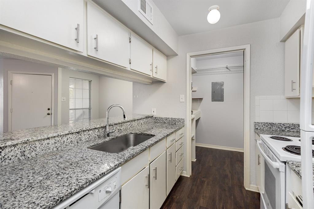 12480 Abrams Road, Unit 723 Dallas, TX 75243 - Photo 9 of 19 a kitchen with granite countertop a sink stainless steel appliances and cabinets