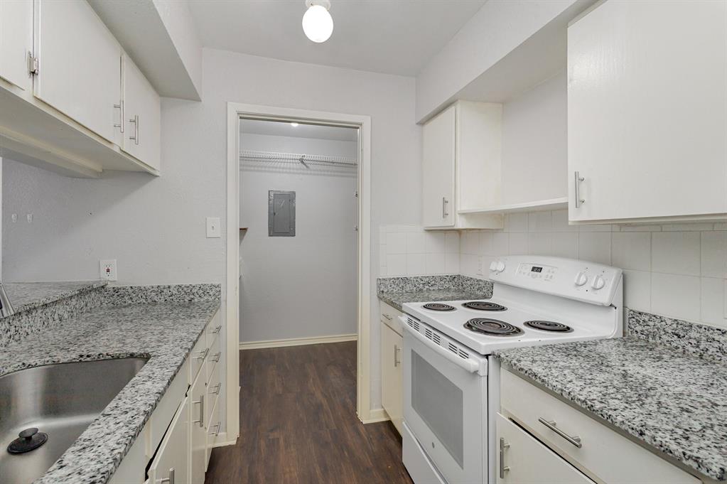 12480 Abrams Road, Unit 723 Dallas, TX 75243 - Photo 10 of 19 a kitchen with granite countertop a sink stove and cabinets