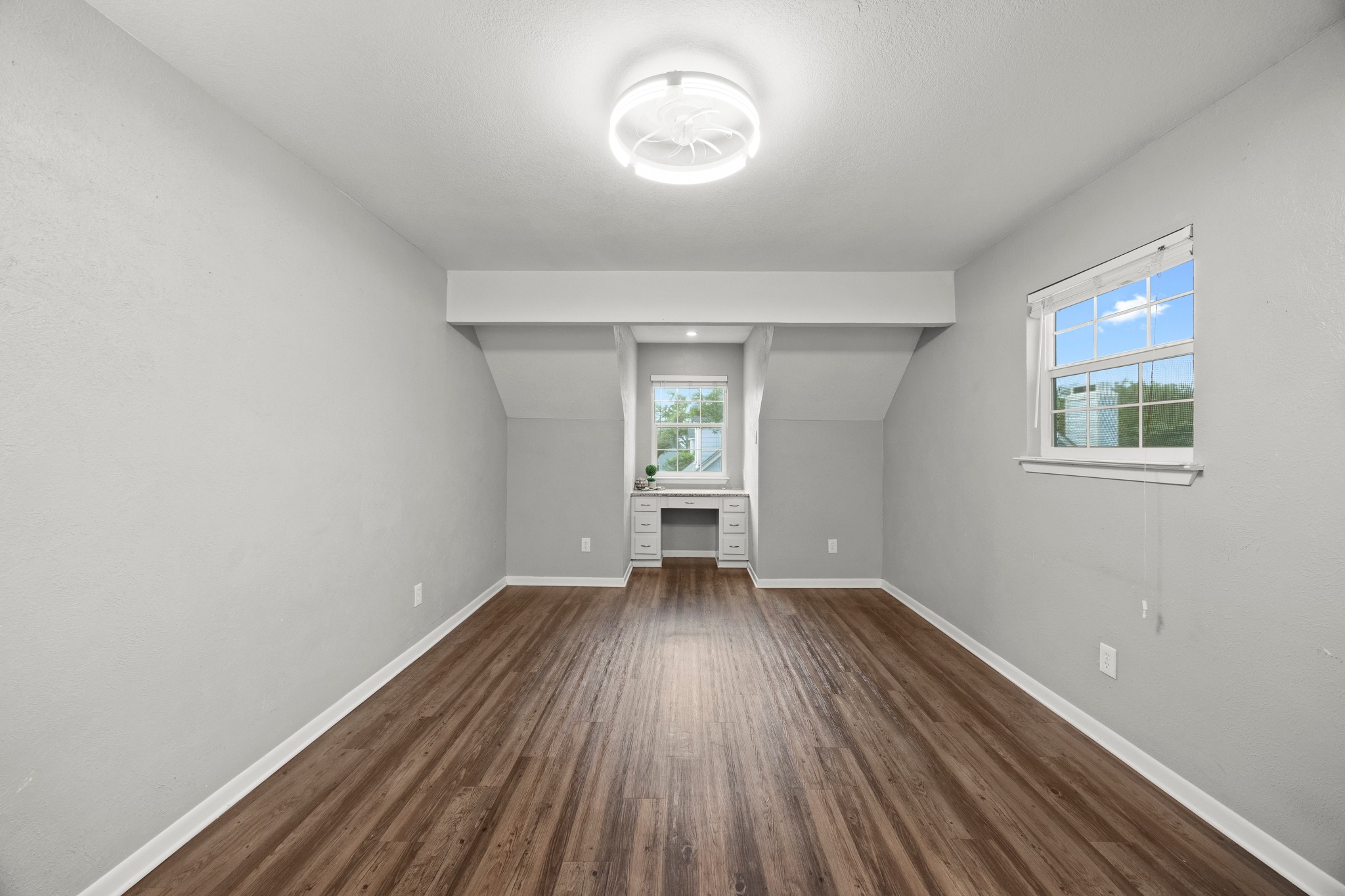 8330 Fathom Circle, Unit 501 Austin, TX 78750 - Photo 16 of 26 an empty room with wooden floor and windows