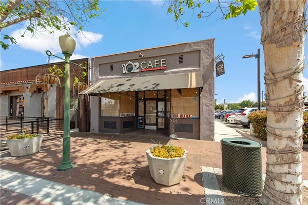 a front view of a building with retail shop and retail shops