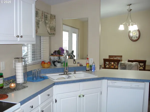 a kitchen with sink and window