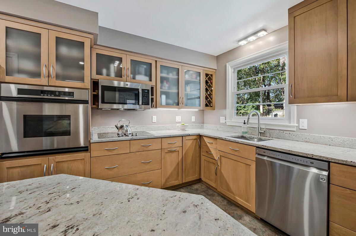 5811 Ridgefield Road Bethesda, MD 20816 - Photo 15 of 33 a kitchen with a sink stove and microwave