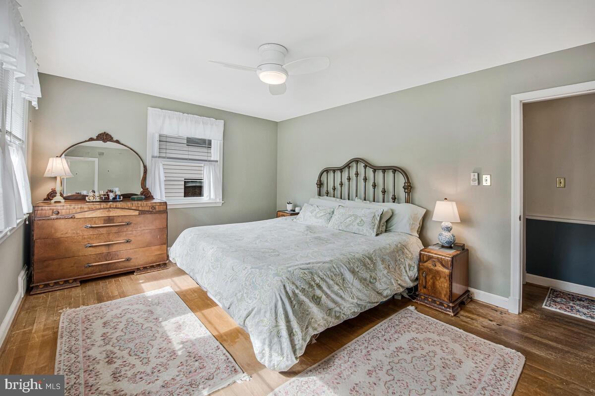 5811 Ridgefield Road Bethesda, MD 20816 - Photo 21 of 33 a bedroom with a bed and wooden floor