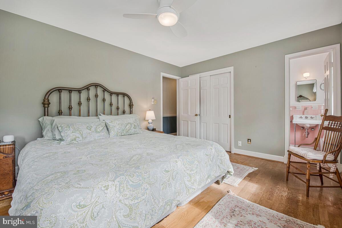 5811 Ridgefield Road Bethesda, MD 20816 - Photo 22 of 33 a spacious bedroom with a bed and chair