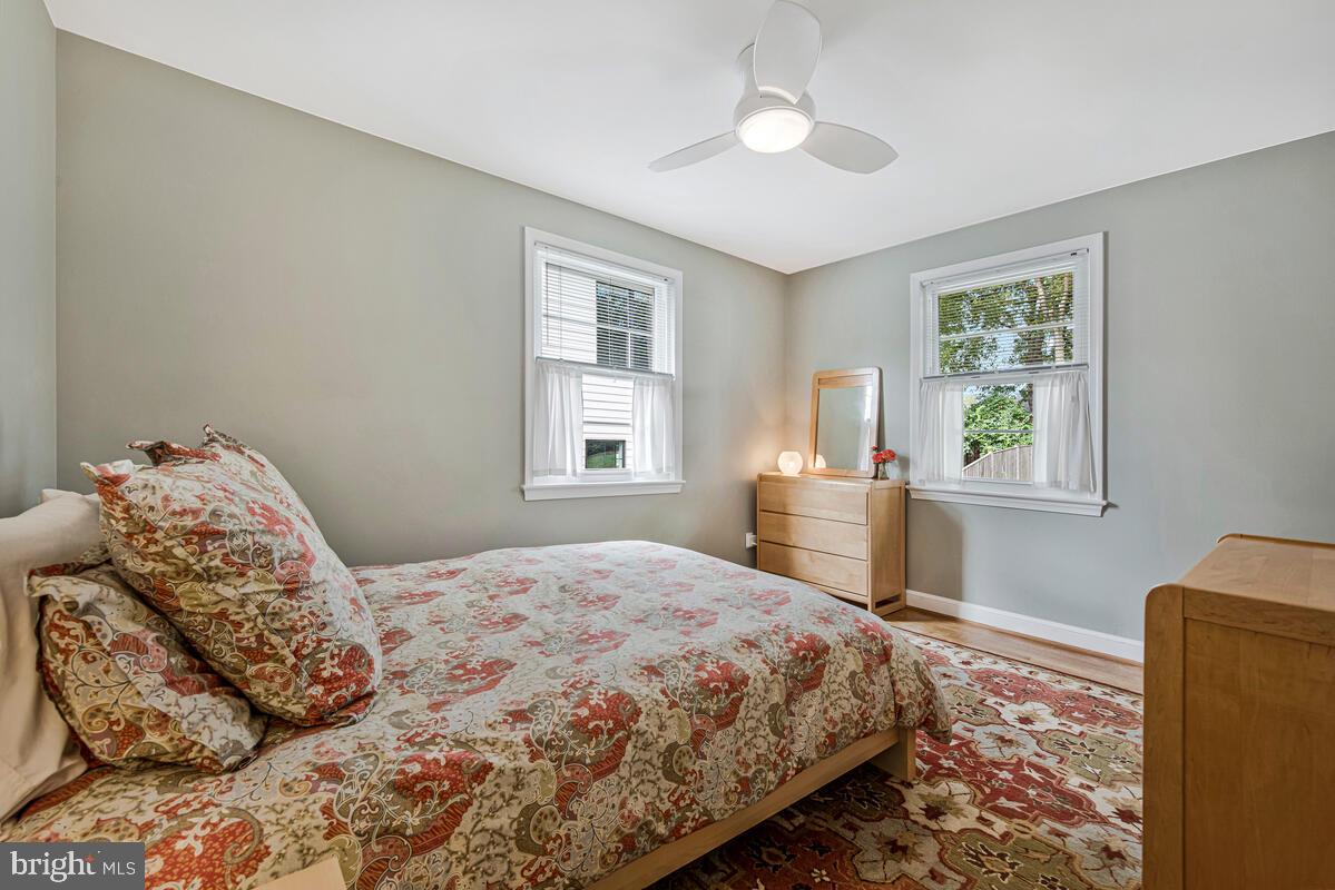5811 Ridgefield Road Bethesda, MD 20816 - Photo 25 of 33 a bedroom with a bed and a window with chair