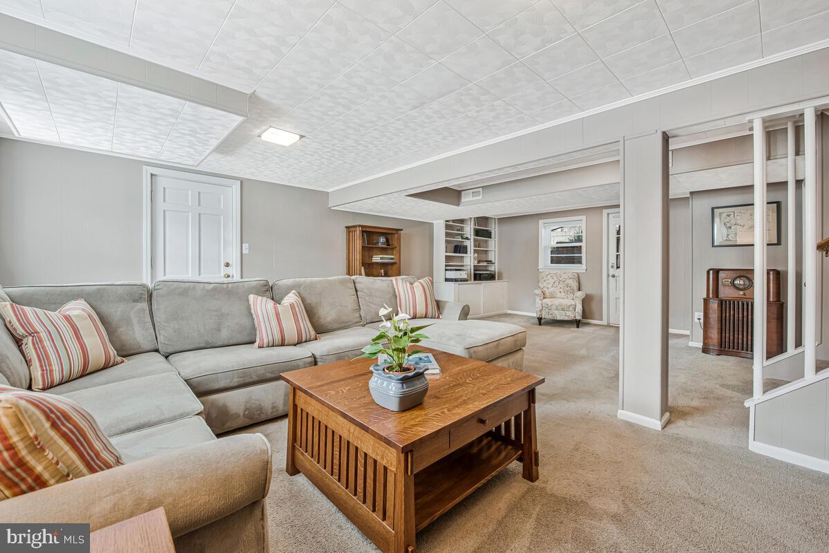 5811 Ridgefield Road Bethesda, MD 20816 - Photo 29 of 33 a living room with furniture and a table