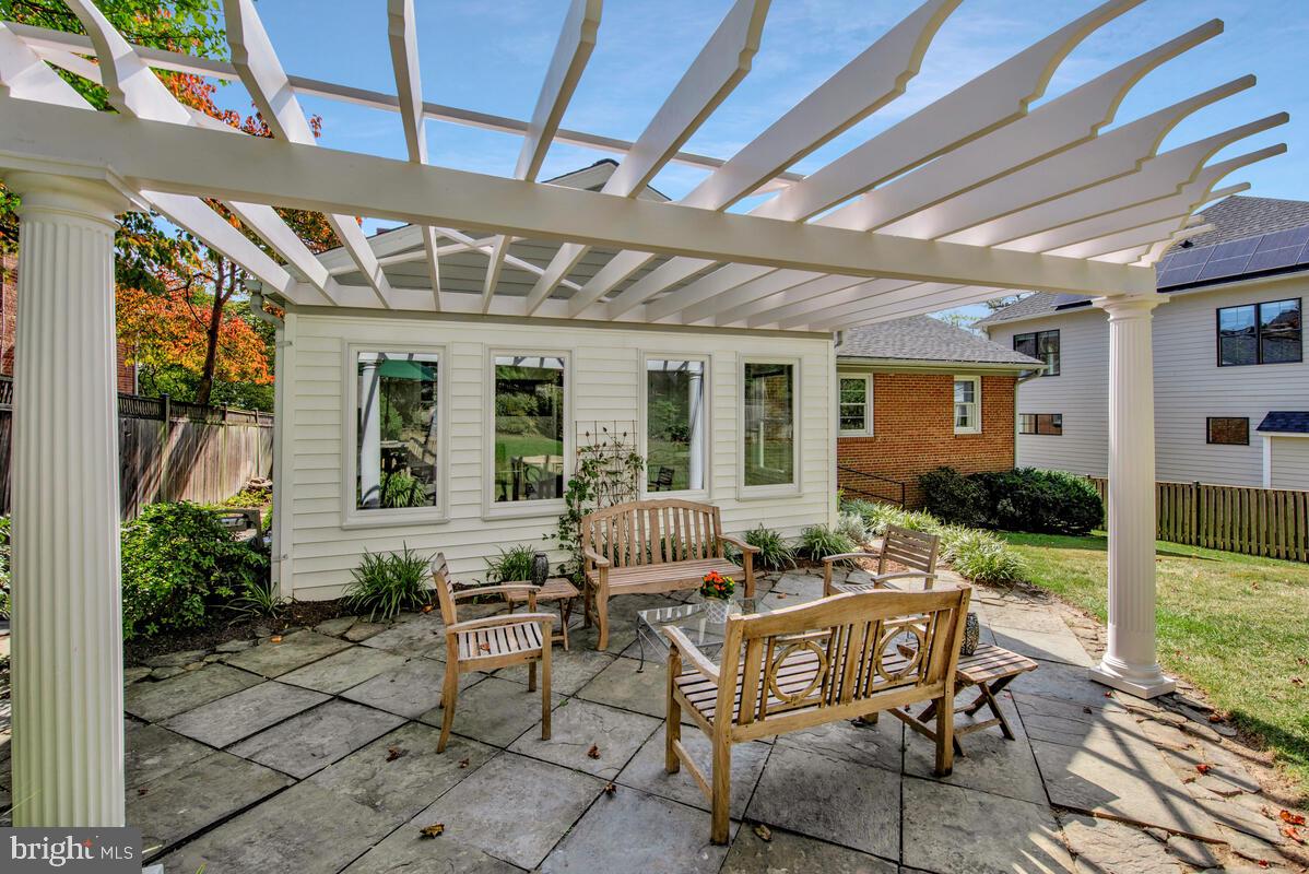 5811 Ridgefield Road Bethesda, MD 20816 - Photo 3 of 33 a view of house with backyard and outdoor seating