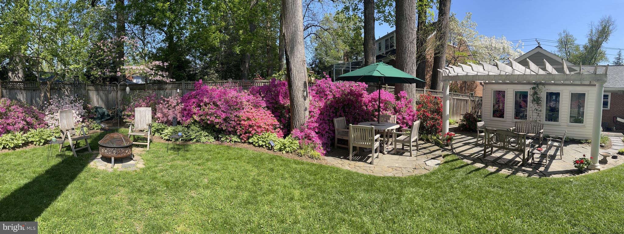 5811 Ridgefield Road Bethesda, MD 20816 - Photo 6 of 33 a view of a chairs and table in a backyard