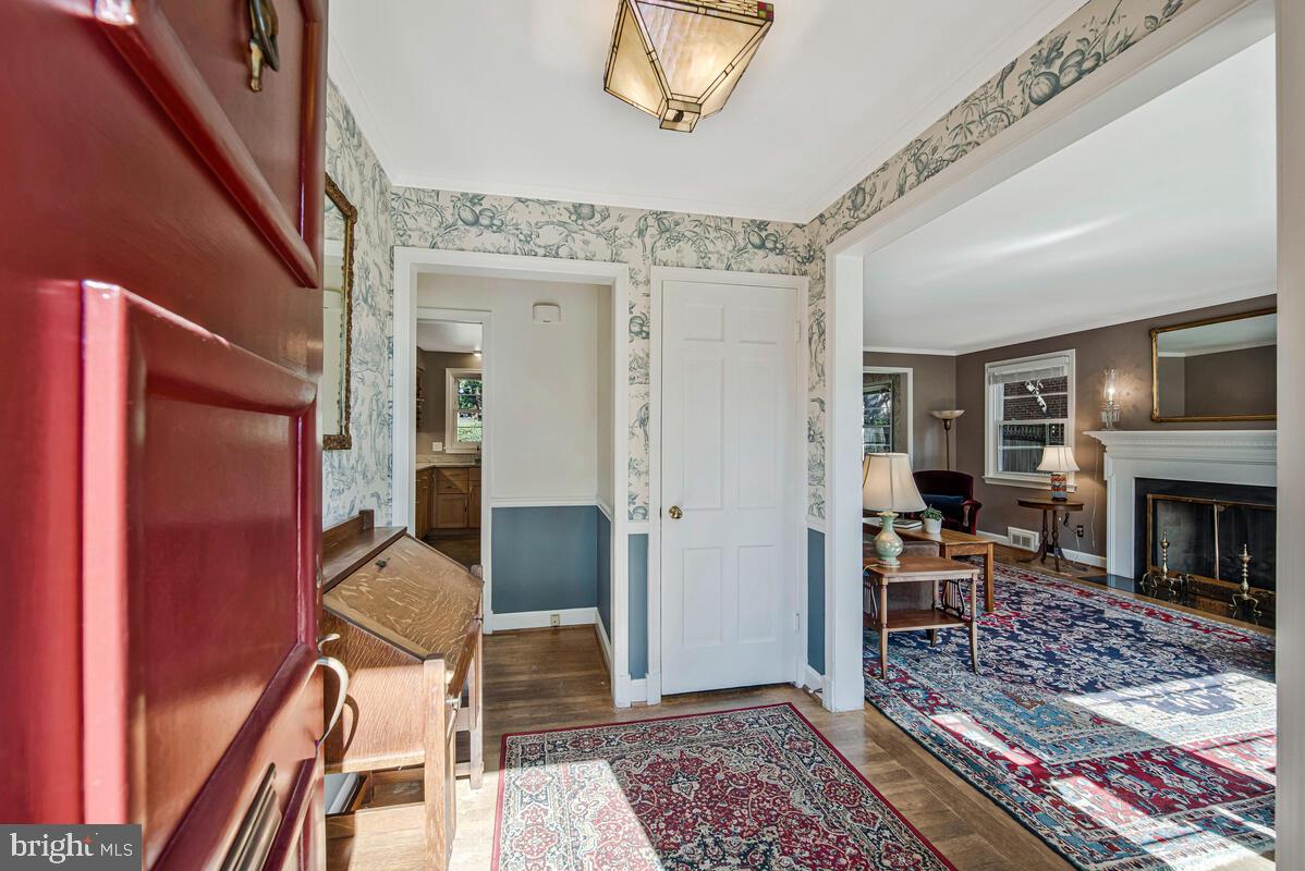 5811 Ridgefield Road Bethesda, MD 20816 - Photo 7 of 33 a living room with furniture and a fireplace
