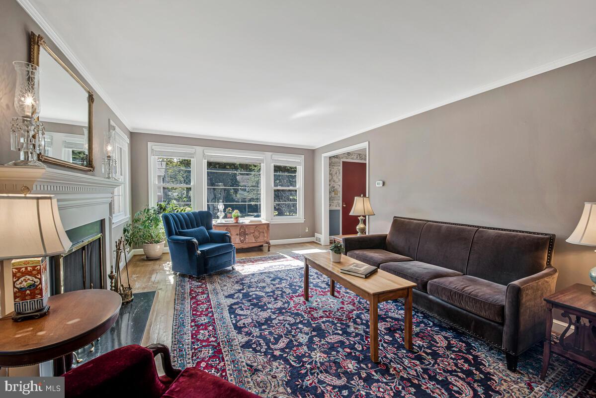 5811 Ridgefield Road Bethesda, MD 20816 - Photo 9 of 33 a living room with furniture and a fireplace