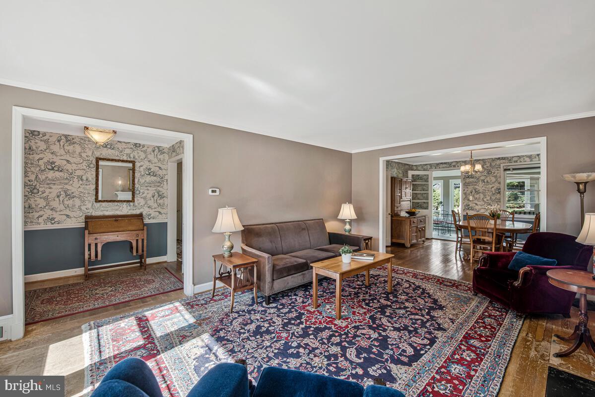 5811 Ridgefield Road Bethesda, MD 20816 - Photo 10 of 33 a living room with furniture and a fireplace