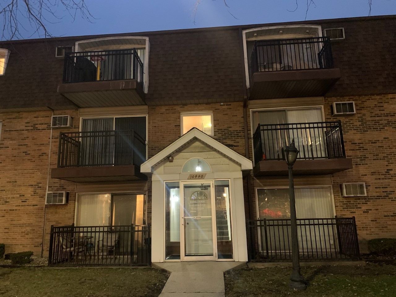 10440 Ridgeland Avenue, Unit 5 Chicago Ridge, IL 60415 - Photo 1 of 22 a view of a brick house with large windows