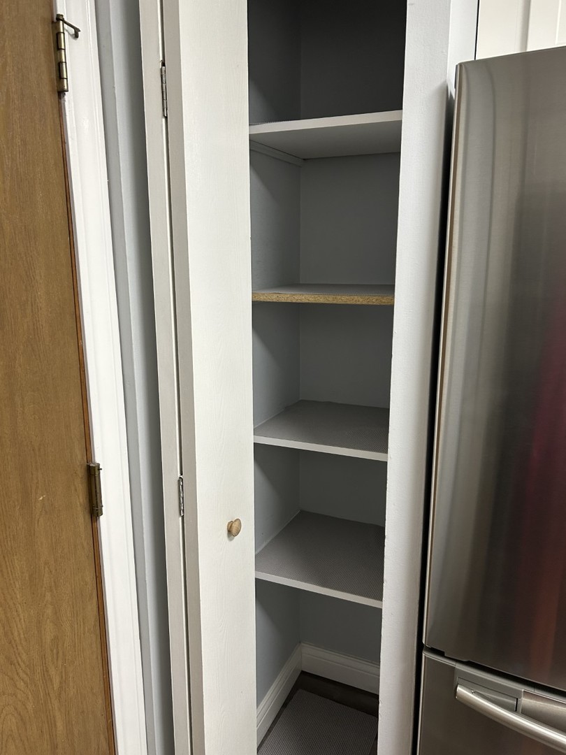 10440 Ridgeland Avenue, Unit 5 Chicago Ridge, IL 60415 - Photo 13 of 22 a view of walk in closet with empty racks
