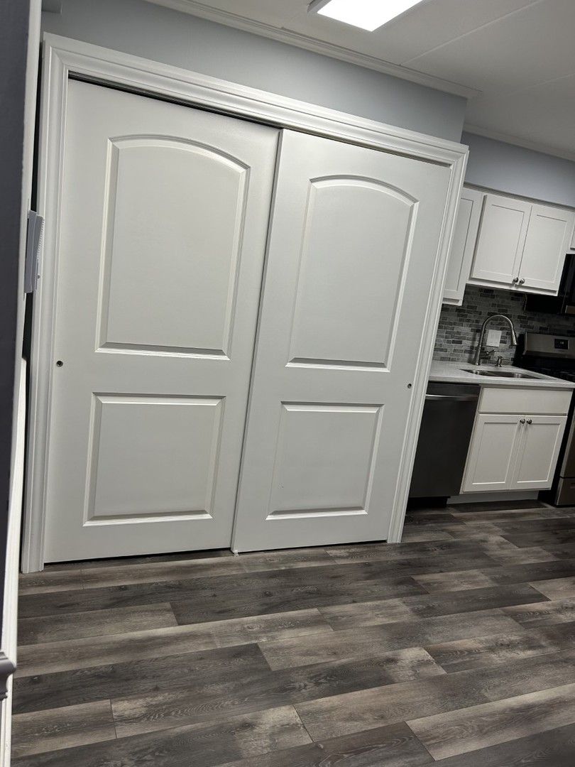 10440 Ridgeland Avenue, Unit 5 Chicago Ridge, IL 60415 - Photo 6 of 22 a white refrigerator freezer sitting inside of a kitchen