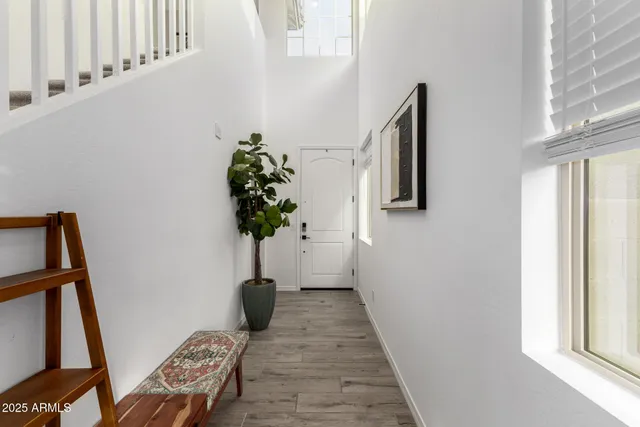 a view of a white apartments with large windows