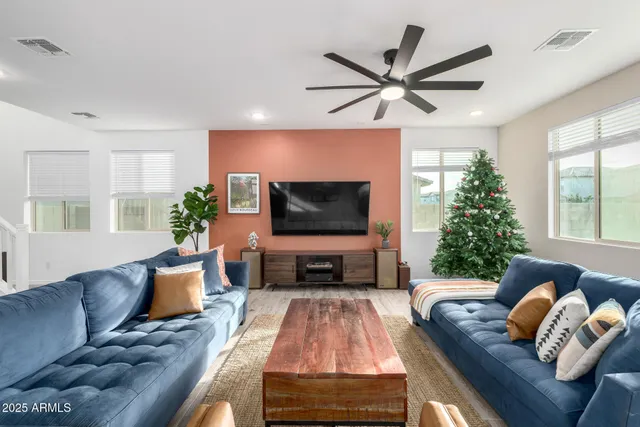 a view of a white house with large windows