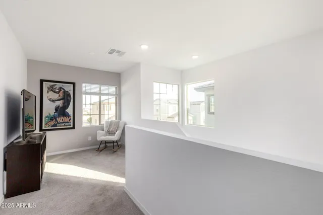 a kitchen with kitchen island a counter space a sink appliances and cabinets
