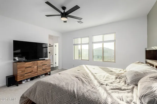 a kitchen with sink a counter and chairs