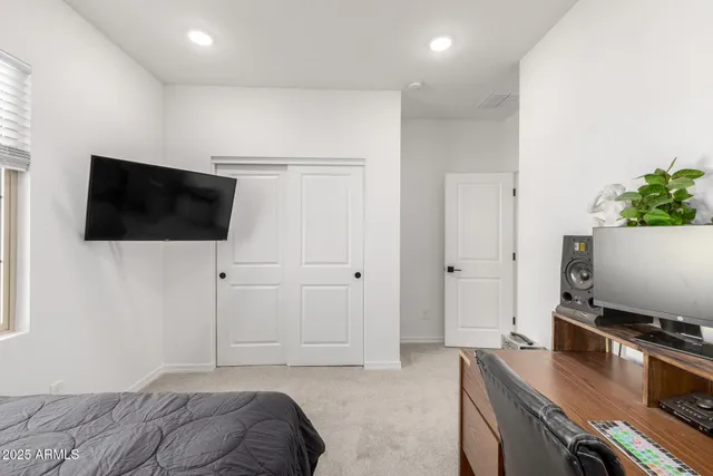 a bedroom with a bed and window